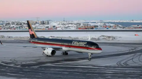 AFP A plane named Trump taxis at an airport in Greenland