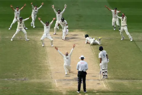 Getty Images Nathan Lyon celebrates after being lbw to Mohammad Siraj as Australia won the match on day five of the men's fourth Test of the series between Australia and India at the Melbourne Cricket Ground on December 30, 2024 in Melbourne, Australia. 