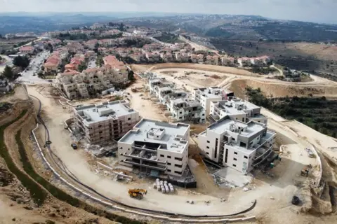 An EPA drone photo shows a construction site for a new neighborhood in the Neve Daniel settlement in the Gush Etzion settlement block in the West Bank on February 15, 2023.