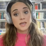 Jinger Duggar in headphones on YouTube.